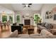 Open concept living room with hardwood floors, fireplace and bright natural light at 4112 Willow Sw Walk, Lilburn, GA 30047