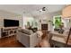 Comfortable living room with hardwood floors, fireplace and view to breakfast area at 4112 Willow Sw Walk, Lilburn, GA 30047
