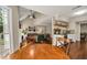 Open floorplan showcases a dining area, kitchen with floating shelves, and living room with fireplace at 4112 Willow Sw Walk, Lilburn, GA 30047
