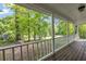 Scenic view from the cozy front porch with classic white railings at 4112 Willow Sw Walk, Lilburn, GA 30047