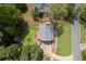 Aerial view of the property showcasing the backyard, deck, and surrounding greenery at 4994 Willow Creek Dr, Woodstock, GA 30188