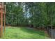 Large backyard with shed and wooded area at 4994 Willow Creek Dr, Woodstock, GA 30188