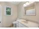 Bright bathroom with a large mirror and vanity with sink at 4994 Willow Creek Dr, Woodstock, GA 30188