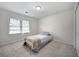 Inviting bedroom with a window and a closet for storage solutions at 4994 Willow Creek Dr, Woodstock, GA 30188