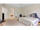 Spacious bedroom with tray ceiling and closet access at 4994 Willow Creek Dr, Woodstock, GA 30188