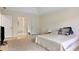 Spacious bedroom with tray ceiling and closet access at 4994 Willow Creek Dr, Woodstock, GA 30188