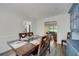 Inviting dining room with wood flooring and views through to the living room and kitchen at 4994 Willow Creek Dr, Woodstock, GA 30188