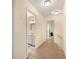 Hallway featuring neutral paint leading to a bathroom at 4994 Willow Creek Dr, Woodstock, GA 30188