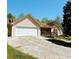 Charming single-story home with an attached two-car garage and a quaint front porch at 6690 Jenkins Rd, Fairburn, GA 30213