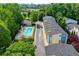 An aerial view of the neighborhood, surrounded by trees, and the community swimming pool at 1346 Peter Haughton Nw Way, Atlanta, GA 30318