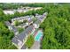 Aerial view featuring a community among trees and a pool at 1346 Peter Haughton Nw Way, Atlanta, GA 30318