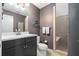 Modern bathroom with a vanity, unique decor and a separate tiled shower, offering a luxurious feel at 1346 Peter Haughton Nw Way, Atlanta, GA 30318