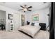 Contemporary bedroom with stylish decor, a ceiling fan, and access to the bathroom at 1346 Peter Haughton Nw Way, Atlanta, GA 30318