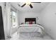 Serene bedroom with soft natural light, plush carpeting, and minimalist decor at 1346 Peter Haughton Nw Way, Atlanta, GA 30318