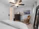 Inviting bedroom with carpet, ceiling fan, and rocking chair at 1346 Peter Haughton Nw Way, Atlanta, GA 30318