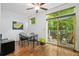 Dining area adjacent to the patio features hardwood floors, a glass table, and outdoor access at 1346 Peter Haughton Nw Way, Atlanta, GA 30318