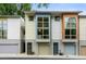 Modern townhome complex with large windows and colorful facade at 1346 Peter Haughton Nw Way, Atlanta, GA 30318