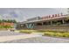 Chattahoochee Works Food Hall facade with inviting outdoor space, benches, and vibrant signage at 1346 Peter Haughton Nw Way, Atlanta, GA 30318