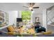 Open-concept living room with hardwood floors, large windows, and modern decor at 1346 Peter Haughton Nw Way, Atlanta, GA 30318