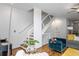 A modern staircase featuring a unique railing design and a cozy seating area nearby at 1346 Peter Haughton Nw Way, Atlanta, GA 30318