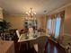 Elegant dining room featuring hardwood floors, a chandelier, and space for formal gatherings at 3393 Chancellors Dr, Powder Springs, GA 30127