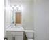 Bright bathroom featuring a white subway-tiled shower and vanity with marble countertop at 3735 Boulder Park Sw Dr, Atlanta, GA 30331