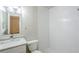 Bright bathroom featuring a white subway-tiled shower and vanity with marble countertop at 3735 Boulder Park Sw Dr, Atlanta, GA 30331