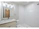 Modern bathroom with a white subway tile shower, marble vanity top, and stylish lighting at 3735 Boulder Park Sw Dr, Atlanta, GA 30331