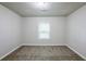 Spacious bedroom featuring plush carpet and a window offering natural light at 3735 Boulder Park Sw Dr, Atlanta, GA 30331