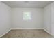 Carpeted bedroom with neutral paint, window, and a bright and airy feel at 3735 Boulder Park Sw Dr, Atlanta, GA 30331