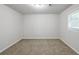 Neutral bedroom with carpet and window offering natural light at 3735 Boulder Park Sw Dr, Atlanta, GA 30331