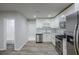 Modern kitchen with stainless steel appliances, white cabinets, and a subway tile backsplash at 3735 Boulder Park Sw Dr, Atlanta, GA 30331