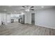 Bright living space showcasing luxury vinyl plank flooring that transitions into an open concept kitchen at 3735 Boulder Park Sw Dr, Atlanta, GA 30331