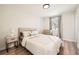 Bedroom featuring a cozy bed, neutral colors, and luxury vinyl flooring at 6552 King George Way, Morrow, GA 30260