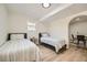 Comfortable bedroom with twin beds, neutral color palette, and a cozy atmosphere perfect for relaxation at 6552 King George Way, Morrow, GA 30260