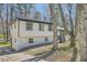 Charming home with brick and siding and large trees in the front yard at 6552 King George Way, Morrow, GA 30260