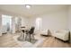 Inviting living area with dining space, neutral decor, and easy access to laundry and other areas at 6552 King George Way, Morrow, GA 30260