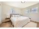 Cozy bedroom with natural light, a plush bed, and stylish decor at 6552 King George Way, Morrow, GA 30260
