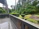Scenic backyard from the deck, highlighted by well-maintained shrubs and a peaceful, wooded setting at 765 Corundum Ct, Stone Mountain, GA 30083