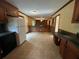 Functional kitchen with tile floor featuring a breakfast bar and sight lines into the adacent rooms at 765 Corundum Ct, Stone Mountain, GA 30083