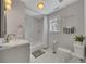 Clean bathroom with a shower-tub combo, modern vanity, and tiled floor at 874 Welch St, Atlanta, GA 30310