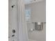 Bathroom featuring a shower, white vanity, and tile surround at 874 Welch St, Atlanta, GA 30310