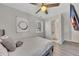 Bedroom with ceiling fan, stylish artwork, and ensuite bathroom at 874 Welch St, Atlanta, GA 30310