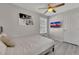 Bright bedroom with ceiling fan, wall-mounted tv, and neutral decor at 874 Welch St, Atlanta, GA 30310