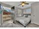 Bright bedroom with deck access boasts a ceiling fan and large window at 874 Welch St, Atlanta, GA 30310