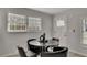 Cozy dining area with a round table, four chairs, and natural light at 874 Welch St, Atlanta, GA 30310
