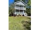 Charming two-story home with double front porches and a well-maintained lawn at 874 Welch St, Atlanta, GA 30310