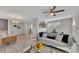 Bright living room featuring modern furniture, a ceiling fan, and large windows at 874 Welch St, Atlanta, GA 30310