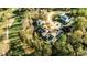 Aesthetic aerial shot capturing a luxury home with a pool, surrounded by mature trees and a manicured golf course at 1572 Clifton Rdg, Atlanta, GA 30307