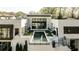 Elevated perspective revealing a modern backyard complete with a lap pool, a grassy area, and sleek outdoor furniture at 1572 Clifton Rdg, Atlanta, GA 30307
